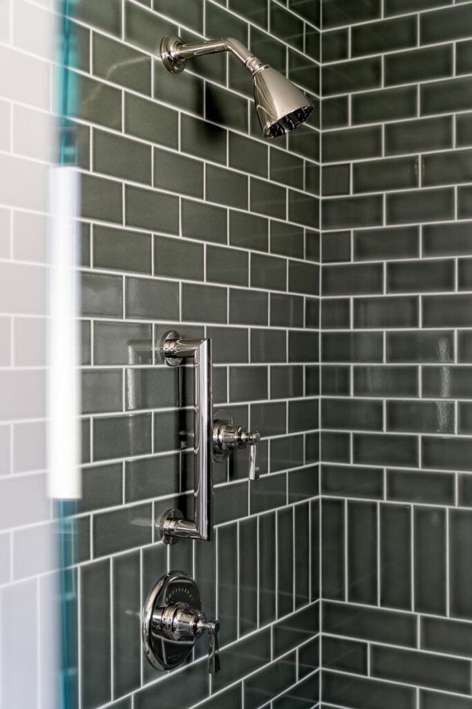 Green tile in bathroom remodel by Melinda Mandell